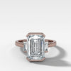 Modern Minimalism: Emerald Cut Half Bezel Ring with Baguettes