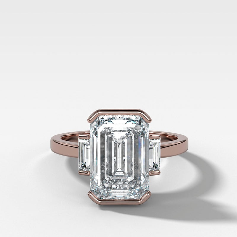 Modern Minimalism: Emerald Cut Half Bezel Ring with Baguettes