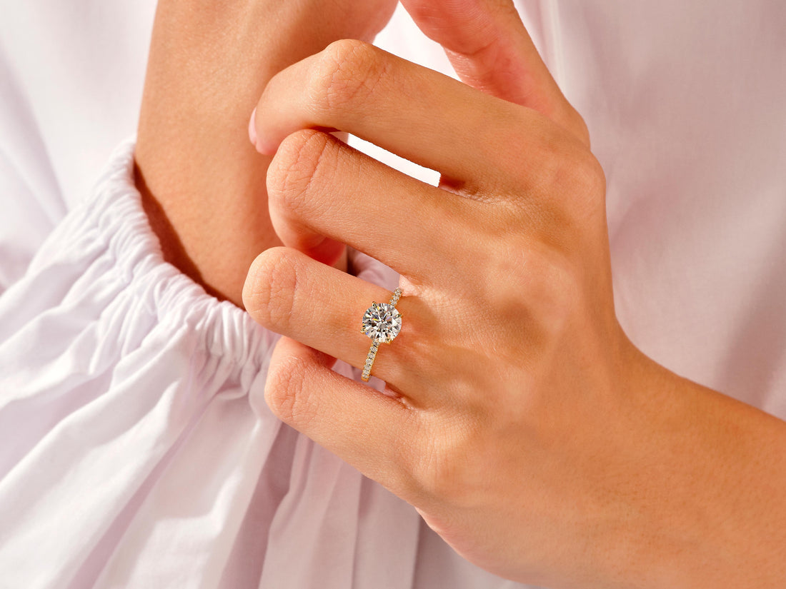 Cathedral Round Cut Moissanite Engagement Ring with Pave Set Side Stones (1.50 CT)