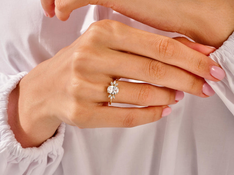 Marquise Cluster Accent Oval Cut Moissanite Engagement Ring (1.50 CT)