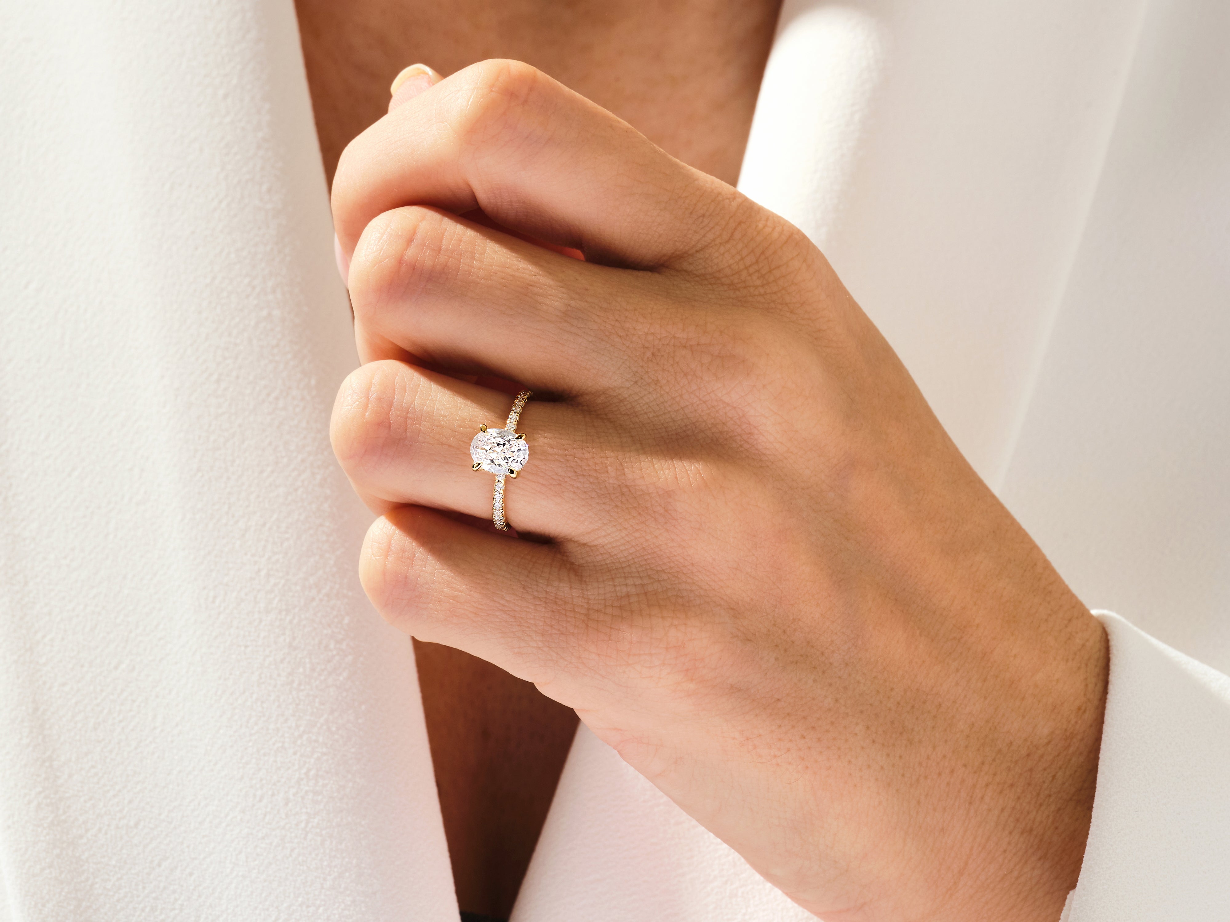 Hidden Halo Oval Moissanite Engagement Ring with Sidestones (1.50 CT)