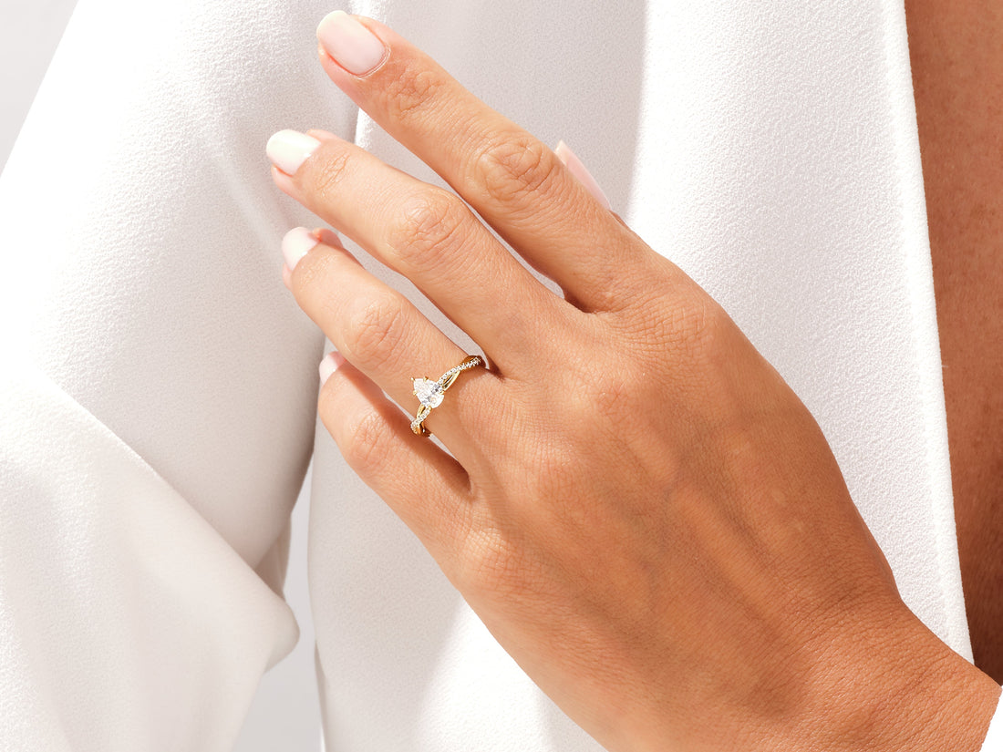 Pear Twisted Moissanite Engagement Ring with Pave Set Side Stones (1.00 CT)
