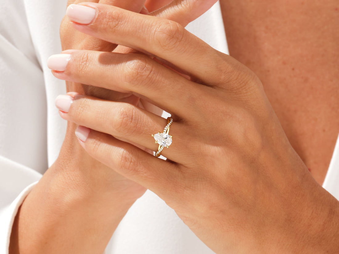 Pear Twisted Moissanite Engagement Ring with Pave Set Side Stones (1.50 CT)