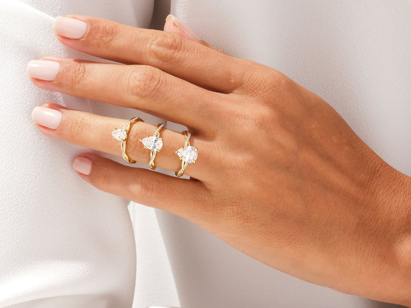 Pear Twisted Moissanite Engagement Ring with Pave Set Side Stones (1.50 CT)