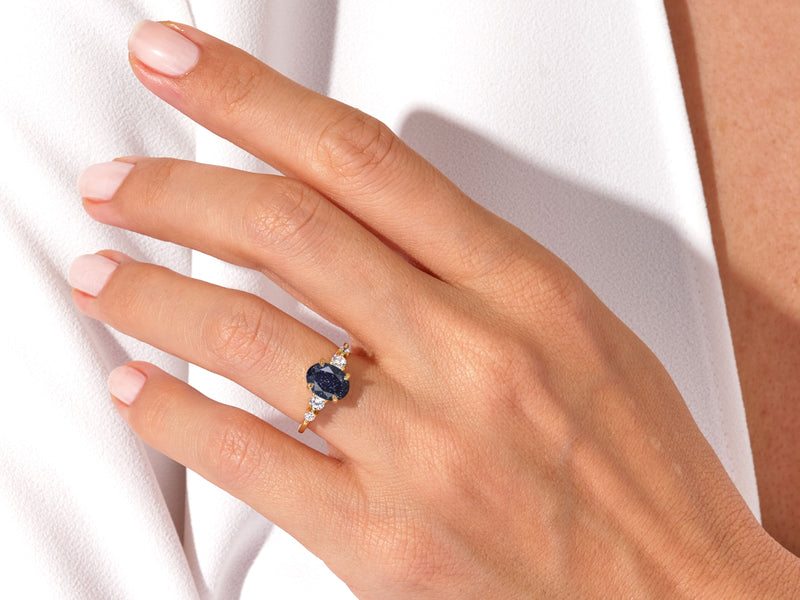 Oval Blue Sandstone Engagement Ring with Moissanite Sidestones.