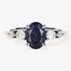 Oval Blue Sandstone Engagement Ring with Moissanite Sidestones.