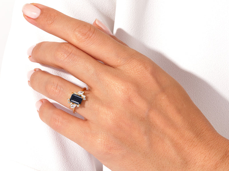 Emerald Cut Blue Sandstone Engagement Ring with Marquise and Round Moissanite Sidestones.