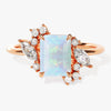 Emerald Cut Opal Engagement Ring with Marquise and Round Moissanite Sidestones