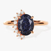 Oval Blue Sandstone Engagement Ring with Round Moissanite Sidestones.