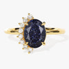 Oval Blue Sandstone Engagement Ring with Round Moissanite Sidestones.