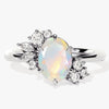 Oval Opal Engagement Ring with Round Moissanite Cluster