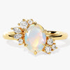 Oval Opal Engagement Ring with Round Moissanite Cluster