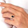 Oval Blue Sandstone Engagement Ring with Round Moissanite Cluster.