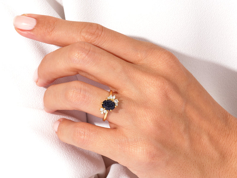 Oval Blue Sandstone Engagement Ring with Round Moissanite Cluster.