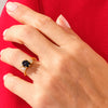 Oval Blue Sandstone Engagement Ring with Round Moissanite Cluster.