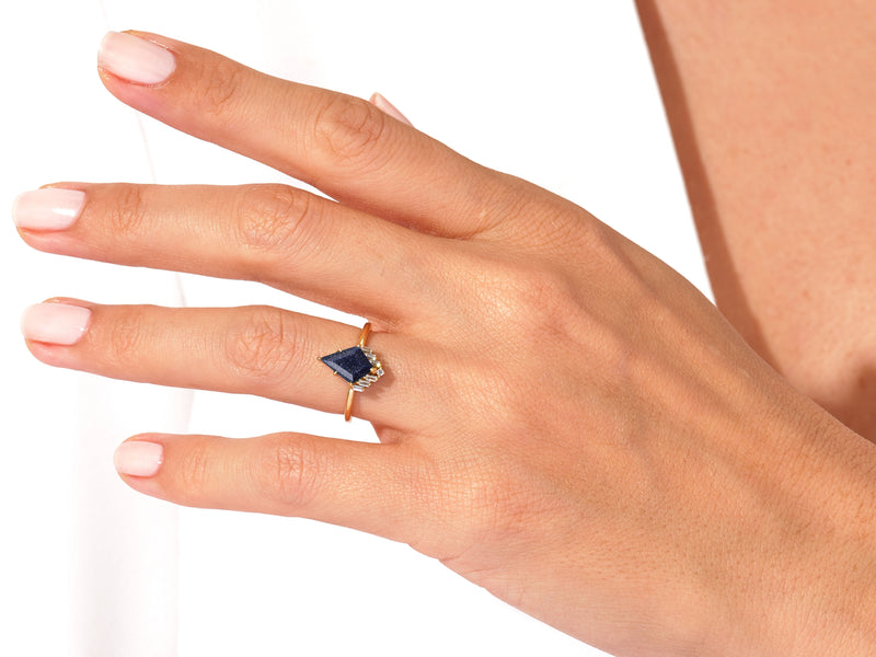 Kite Blue Sandstone Engagement Ring with Baguette Moissanite Sidestones.