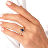 Kite Blue Sandstone Curved Engagement Ring with Moissanite Sidestones.