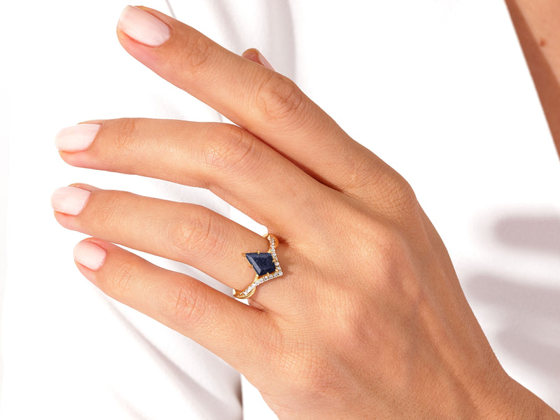 Kite Blue Sandstone Curved Engagement Ring with Moissanite Sidestones.
