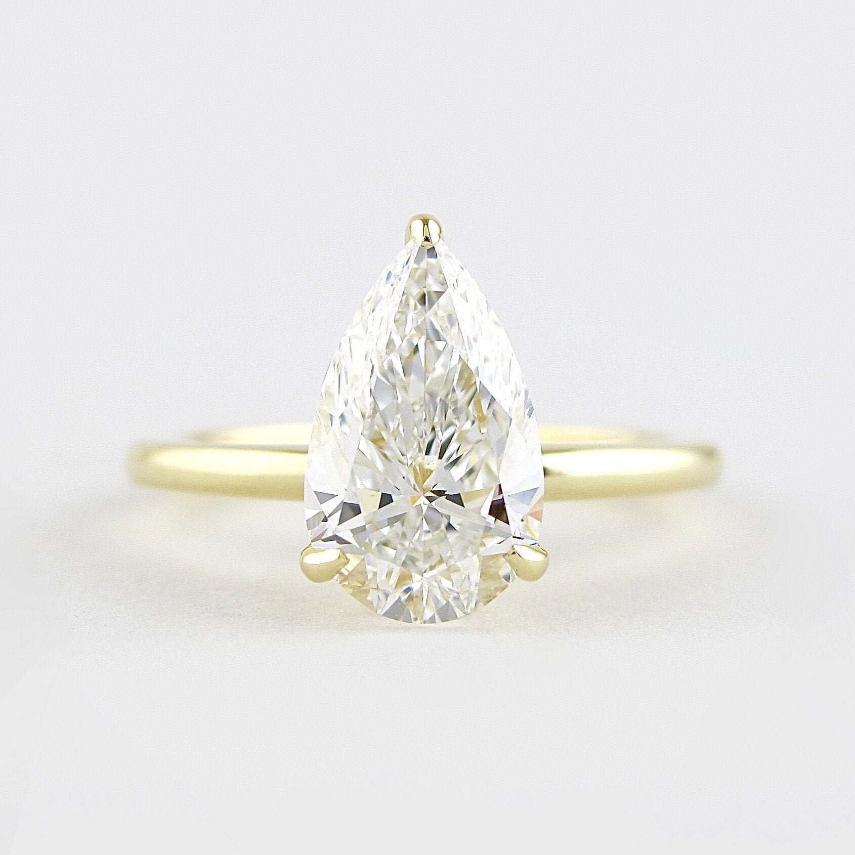 1.50CT Pear Moissanite Solitaire Engagement Ring With Hidden Halo Setting