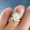Modern Minimalism: Emerald Cut Half Bezel Ring with Baguettes