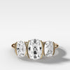 elongated-old-mine-cut-three-stone-ring-half-bezel